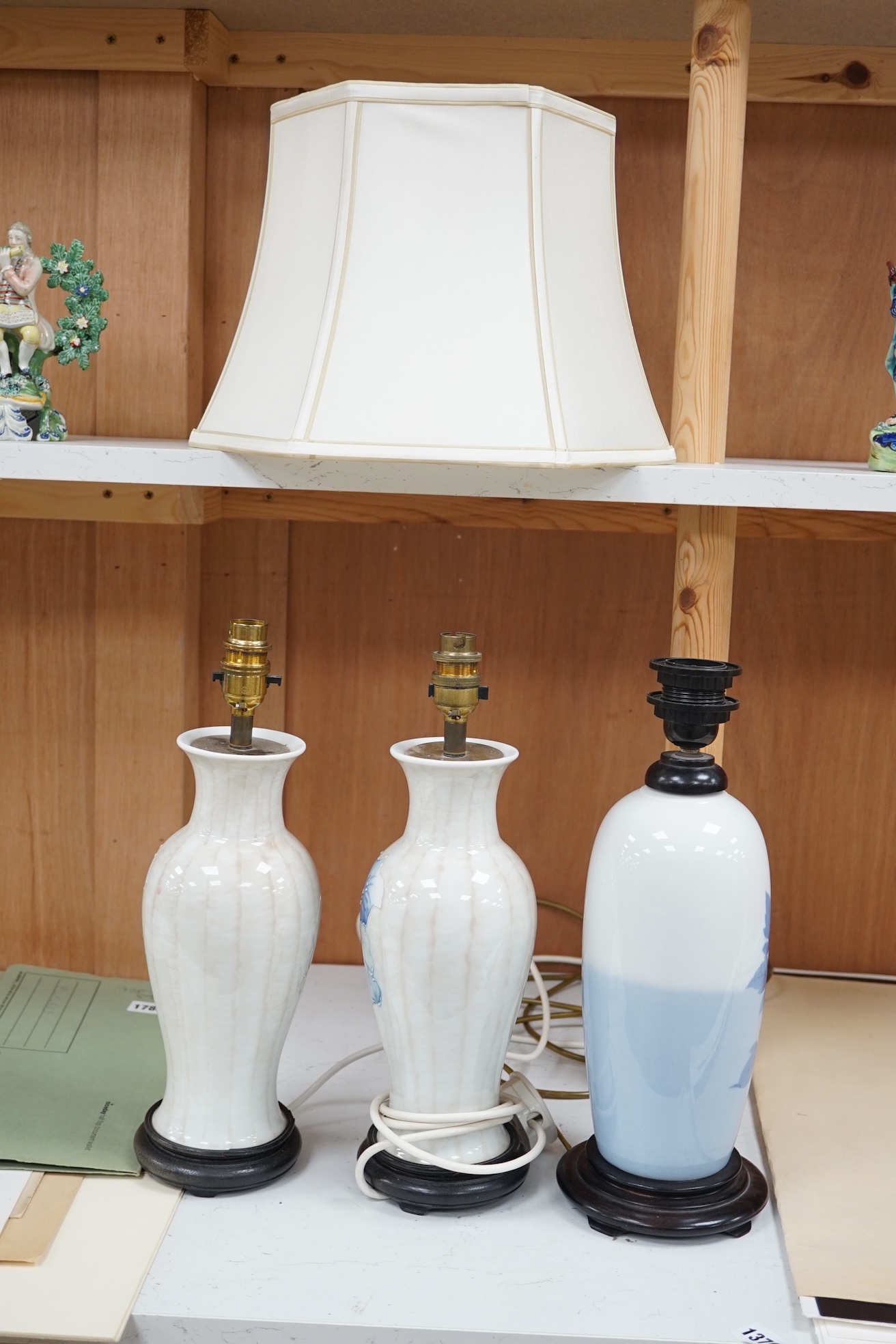 A pair of modern porcelain table lamps, and one other, one with shade (3). Condition - good, not tested